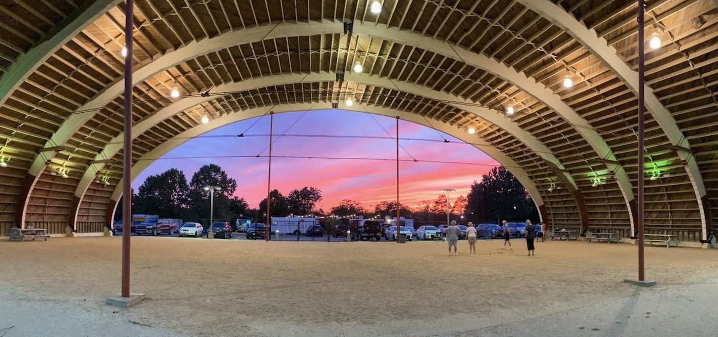 The Browning Hangar at sunset, glowing pink against the evening sky in Austin.